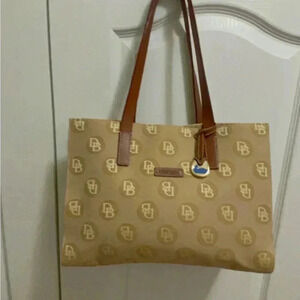 Dooney and Bourke gorgeous cream and tan with the tough of  brown color bag
